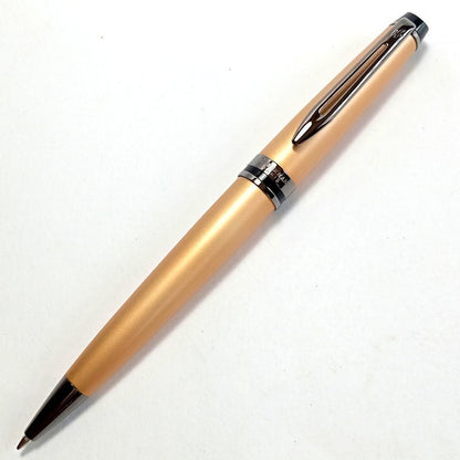 Waterman Expert Metallic Gold RT Ballpoint Pen with sleek metallic finish and black grip, 142mm long
