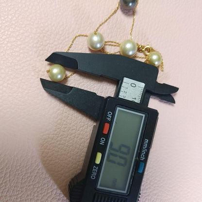 K18 Akoya pearl station necklace with large 10 mm Akoya pearls and a Tahitian pearl top on a 50 cm chain