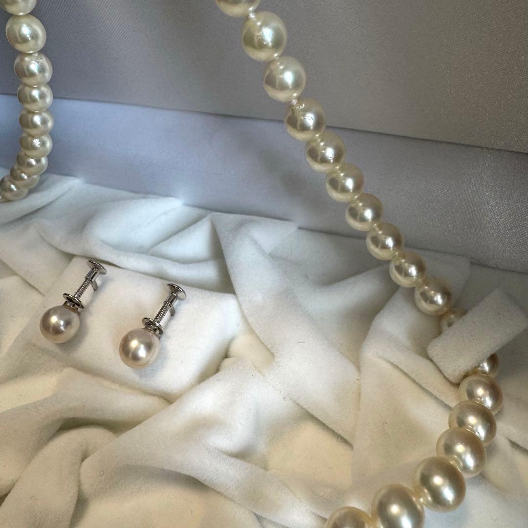 Akoya pearl necklace and earrings set featuring 7.3mm white and cream pearls displayed without accessory case