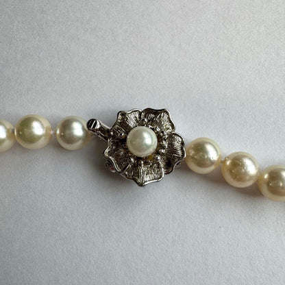 Akoya pearl necklace and earrings set featuring 7.3mm white and cream pearls displayed without accessory case