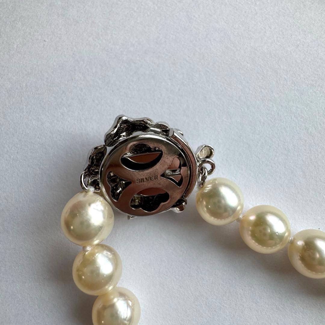 Akoya pearl necklace and earrings set featuring 7.3mm white and cream pearls displayed without accessory case