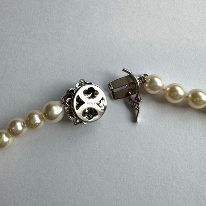 Akoya pearl necklace and earrings set featuring 7.3mm white and cream pearls displayed without accessory case