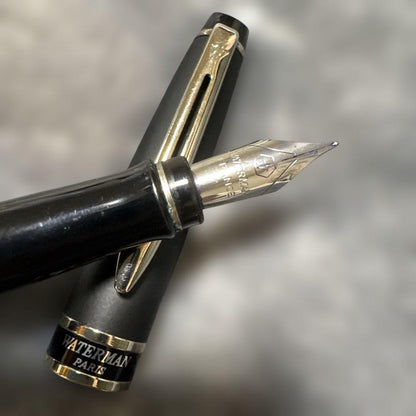 WATERMAN PARIS black fountain pen with stainless steel tip shown on white background
