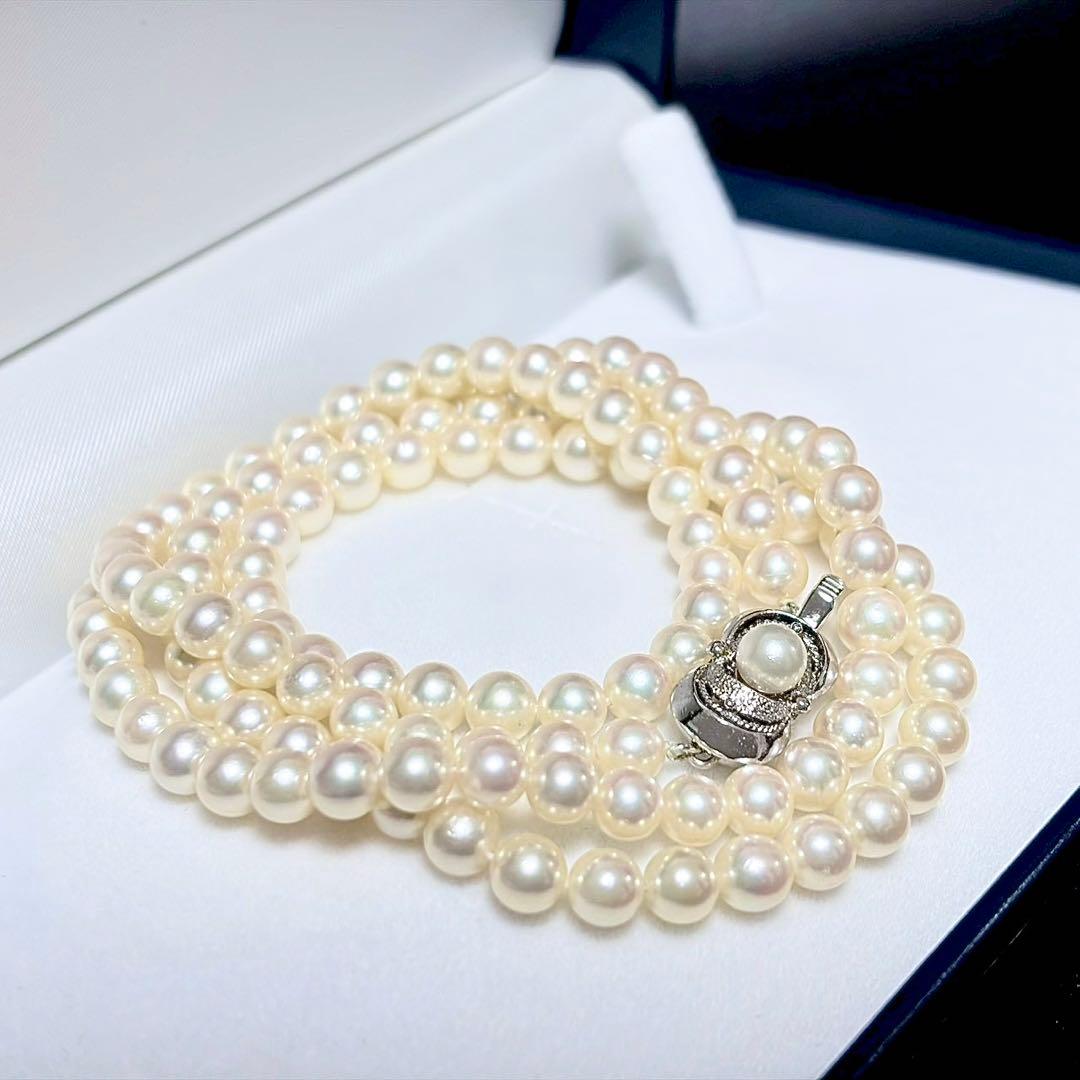 Akoya Pearl Long Necklace 75cm with round 5.6-5.9mm white pearls on a white background