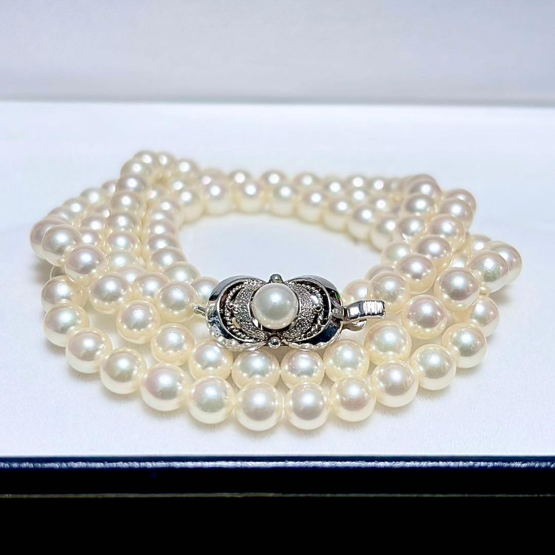 Akoya Pearl Long Necklace 75cm with round 5.6-5.9mm white pearls on a white background