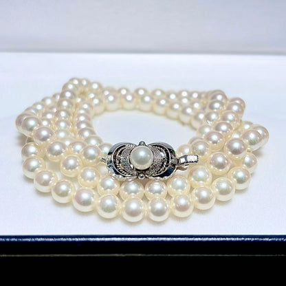 Akoya Pearl Long Necklace 75cm with round 5.6-5.9mm white pearls on a white background