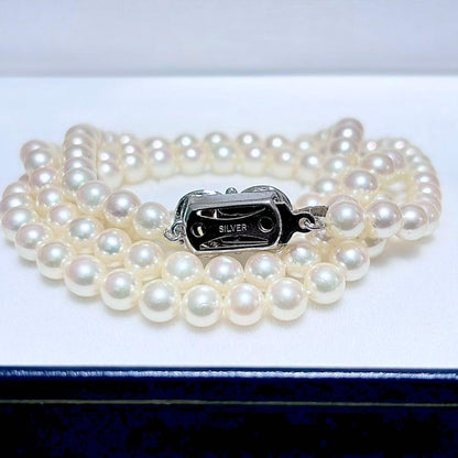 Akoya Pearl Long Necklace 75cm with round 5.6-5.9mm white pearls on a white background