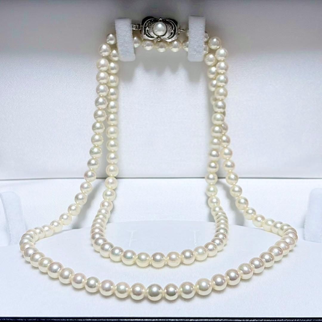 Akoya Pearl Long Necklace 75cm with round 5.6-5.9mm white pearls on a white background
