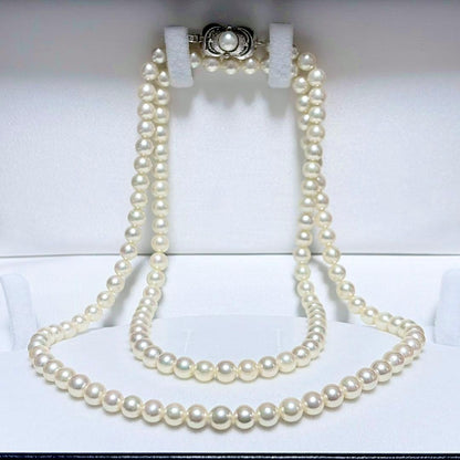 Akoya Pearl Long Necklace 75cm with round 5.6-5.9mm white pearls on a white background