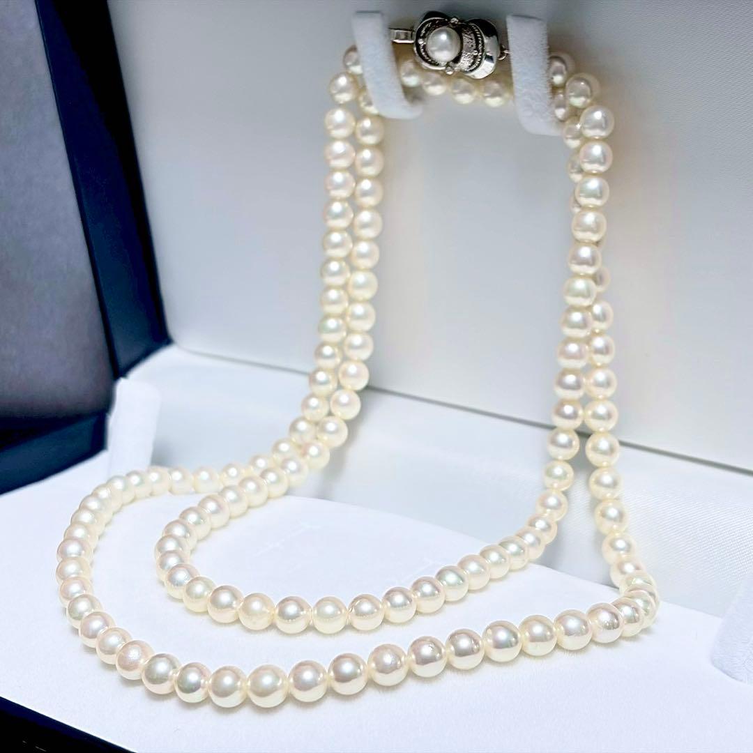 Akoya Pearl Long Necklace 75cm with round 5.6-5.9mm white pearls on a white background