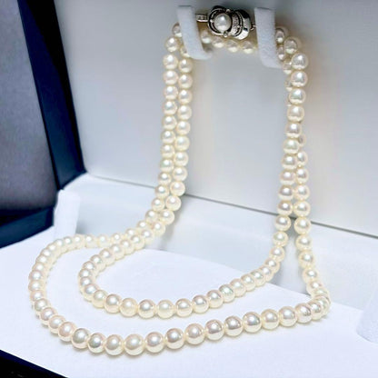 Akoya Pearl Long Necklace 75cm with round 5.6-5.9mm white pearls on a white background