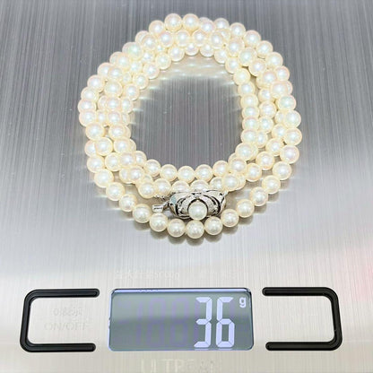 Akoya Pearl Long Necklace 75cm with round 5.6-5.9mm white pearls on a white background