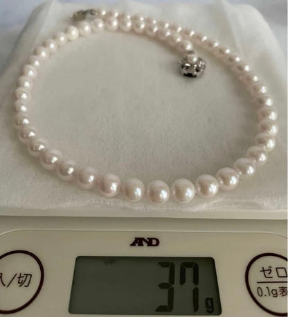 Akoya pearl necklace 8mm with matching 8.5mm pearl earrings in 14K white gold all knot finish