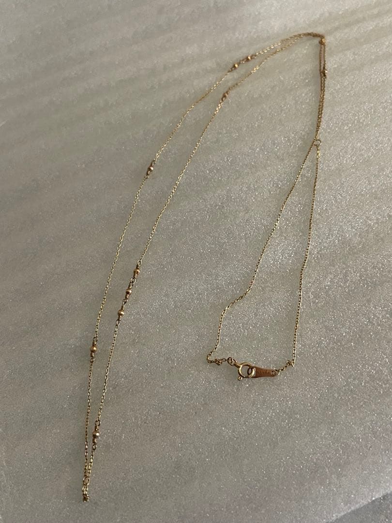 Agete K10 Mirror Ball Long Necklace with 80cm gold chain displayed on white background