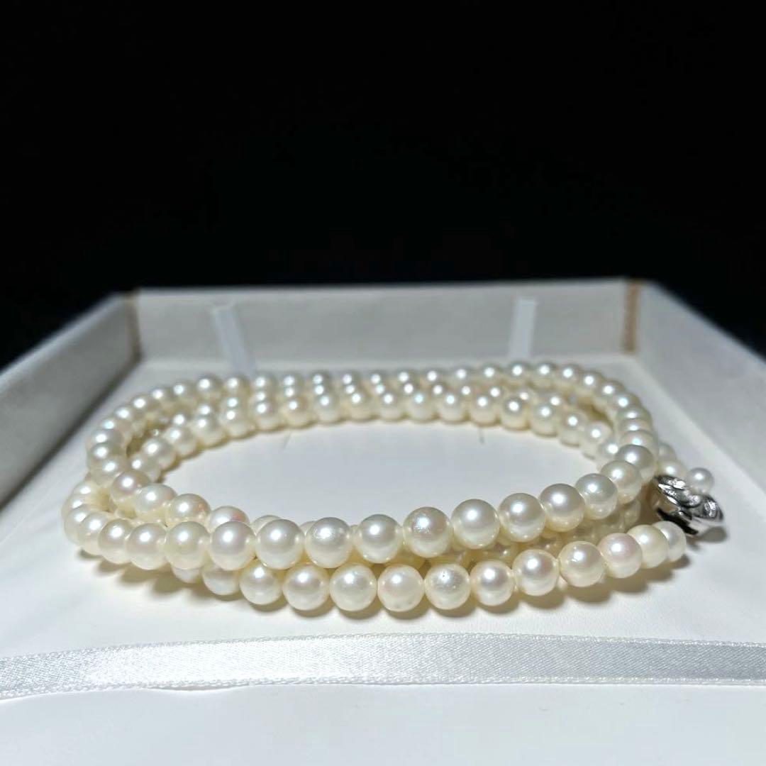 Akoya long pearl necklace with round 6.5-7.0mm white pearls on silver chain, 82cm length