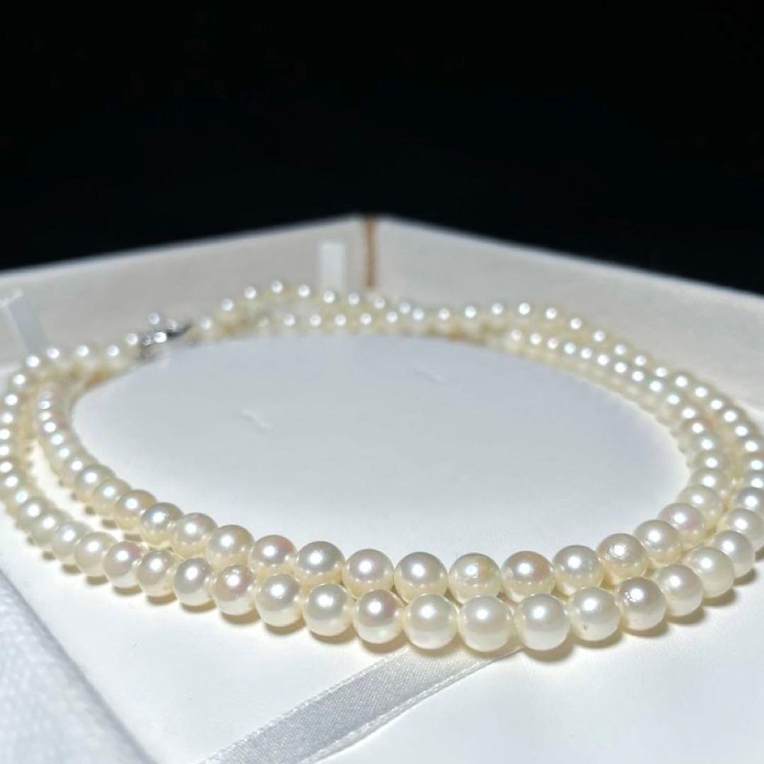 Akoya long pearl necklace with round 6.5-7.0mm white pearls on silver chain, 82cm length