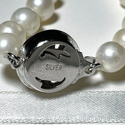 Akoya long pearl necklace with round 6.5-7.0mm white pearls on silver chain, 82cm length