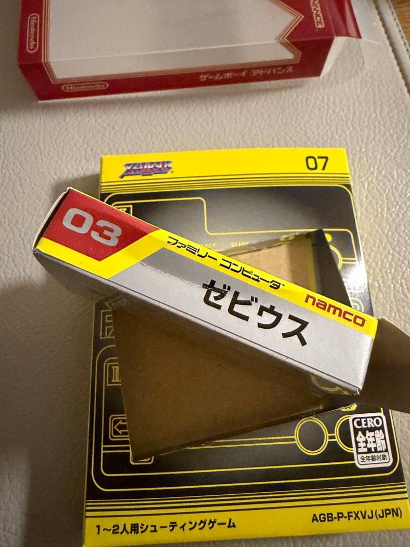 Nintendo Famicom Mini Collection Box with 10 software titles including Zelda showing signs of wear