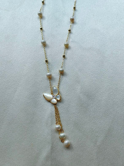 White pearl necklace with white mother-of-pearl butterfly pendant and 5.7mm freshwater pearls on 46cm chain