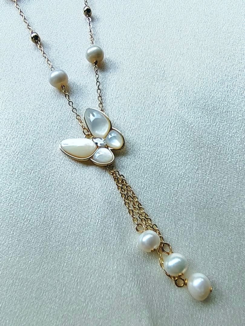 White pearl necklace with white mother-of-pearl butterfly pendant and 5.7mm freshwater pearls on 46cm chain