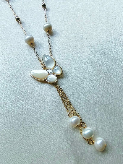 White pearl necklace with white mother-of-pearl butterfly pendant and 5.7mm freshwater pearls on 46cm chain