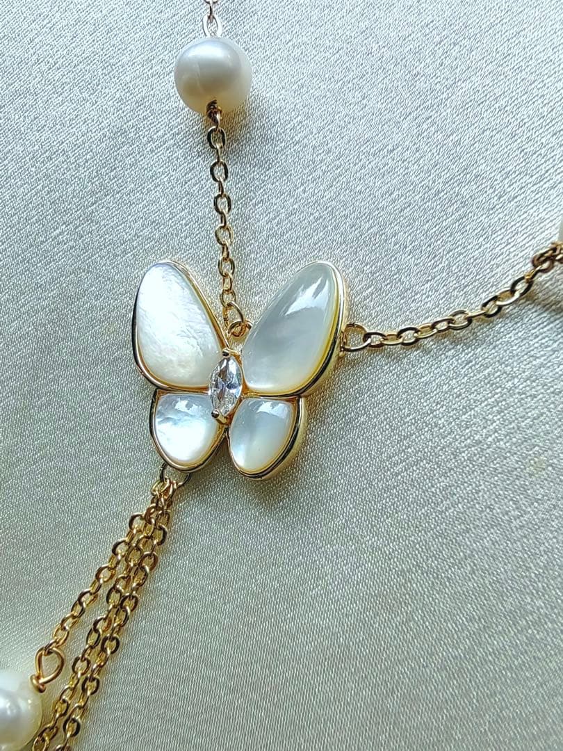White pearl necklace with white mother-of-pearl butterfly pendant and 5.7mm freshwater pearls on 46cm chain