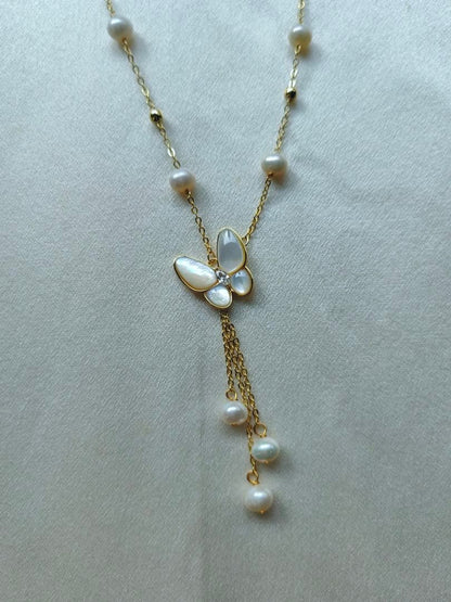 White pearl necklace with white mother-of-pearl butterfly pendant and 5.7mm freshwater pearls on 46cm chain