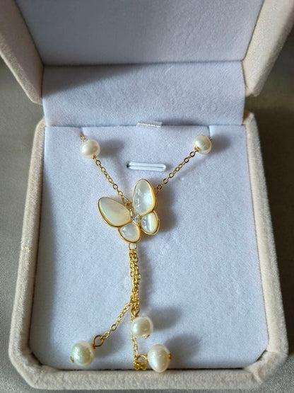 White pearl necklace with white mother-of-pearl butterfly pendant and 5.7mm freshwater pearls on 46cm chain