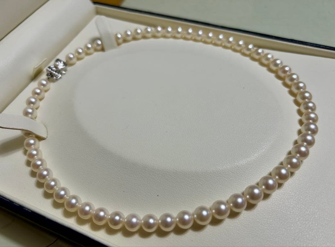 Tasaki Akoya pearl necklace with 7mm pearls and 42cm length featuring a branded clasp