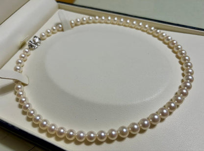 Tasaki Akoya pearl necklace with 7mm pearls and 42cm length featuring a branded clasp