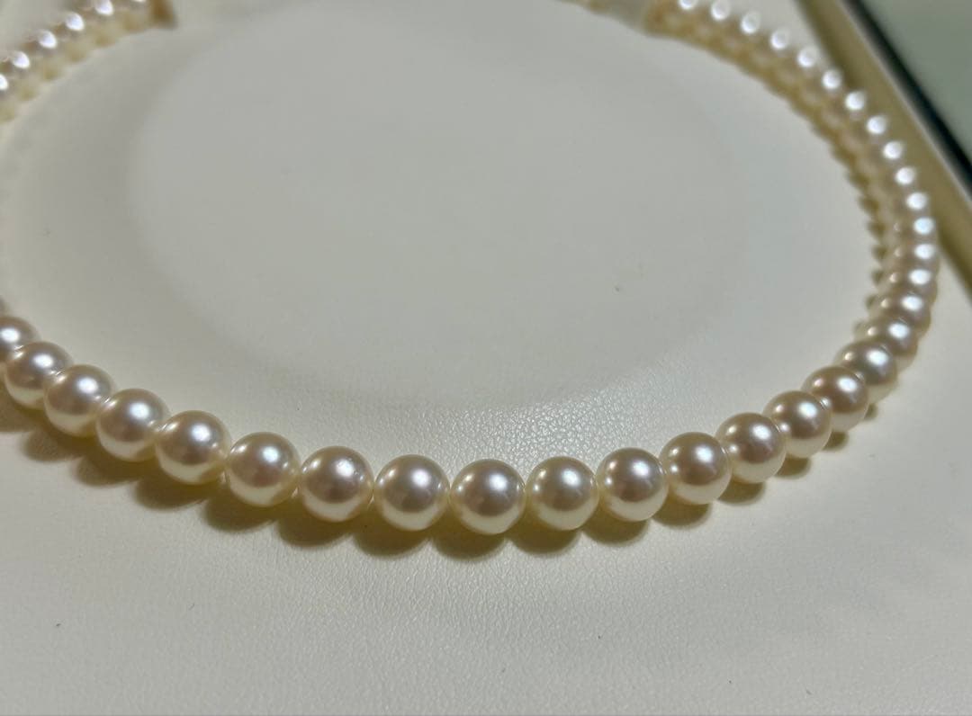 Tasaki Akoya pearl necklace with 7mm pearls and 42cm length featuring a branded clasp