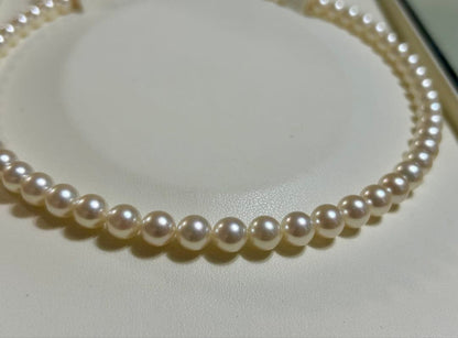 Tasaki Akoya pearl necklace with 7mm pearls and 42cm length featuring a branded clasp