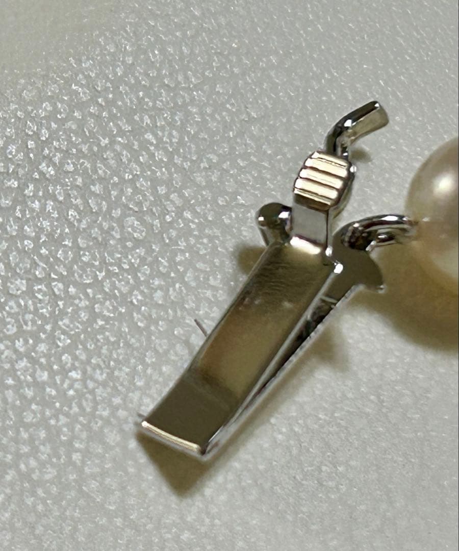Tasaki Akoya pearl necklace with 7mm pearls and 42cm length featuring a branded clasp