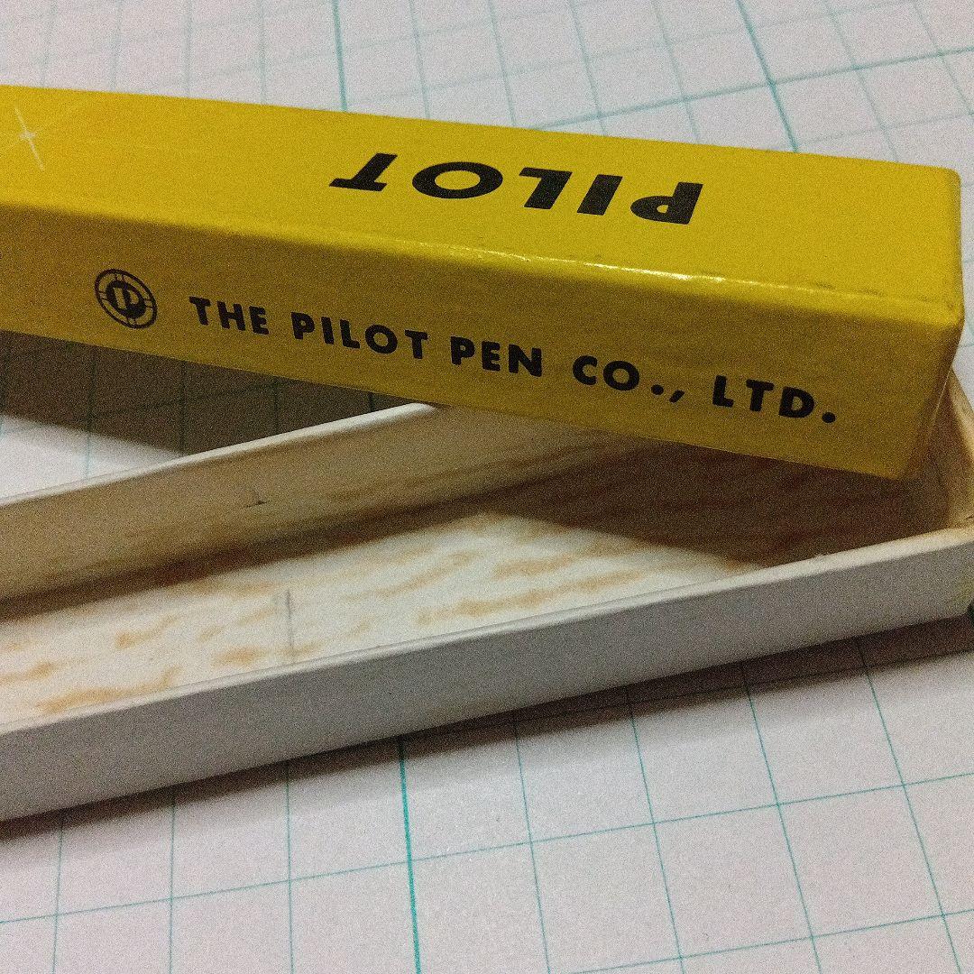 Black Pilot Desk Pen with 14K gold nib showing scratches and discoloration, accompanied by damaged storage box
