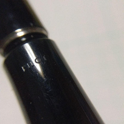 Black Pilot Desk Pen with 14K gold nib showing scratches and discoloration, accompanied by damaged storage box
