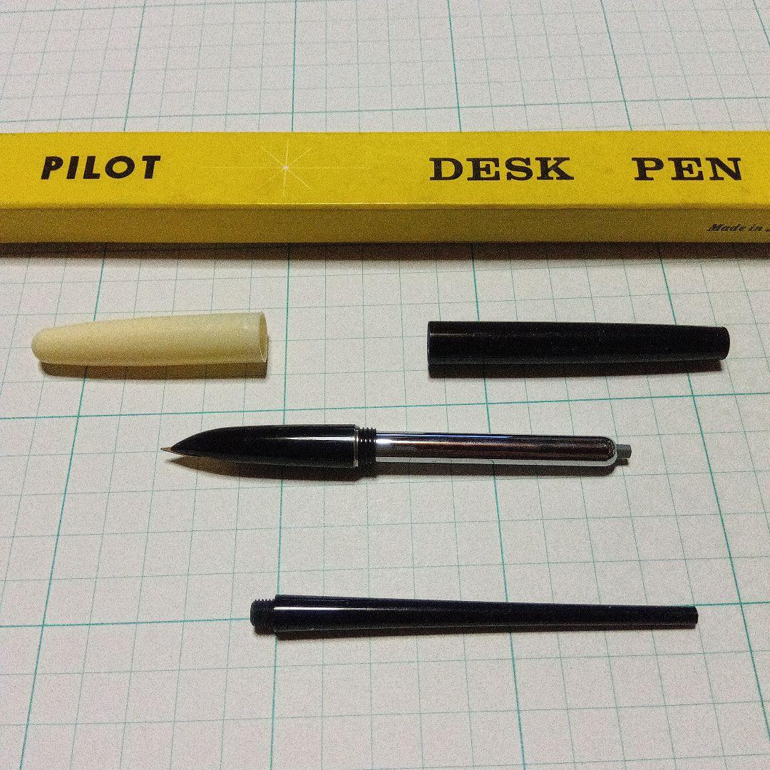 Black Pilot Desk Pen with 14K gold nib showing scratches and discoloration, accompanied by damaged storage box