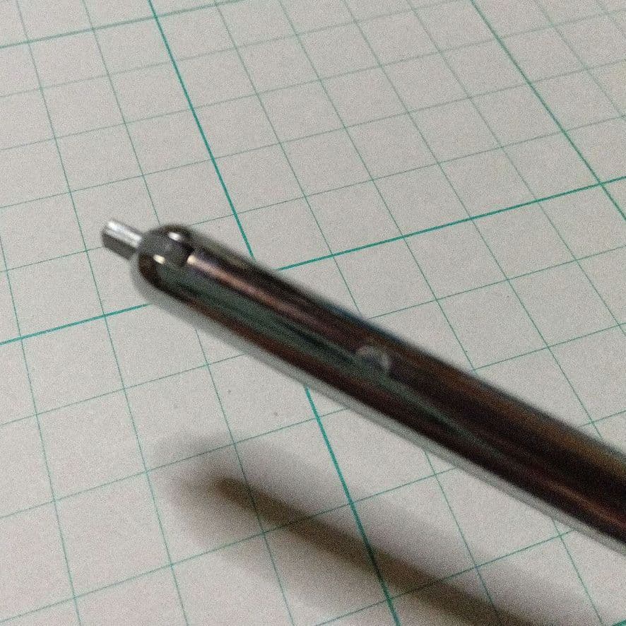 Black Pilot Desk Pen with 14K gold nib showing scratches and discoloration, accompanied by damaged storage box