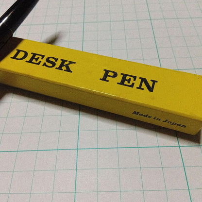 Black Pilot Desk Pen with 14K gold nib showing scratches and discoloration, accompanied by damaged storage box