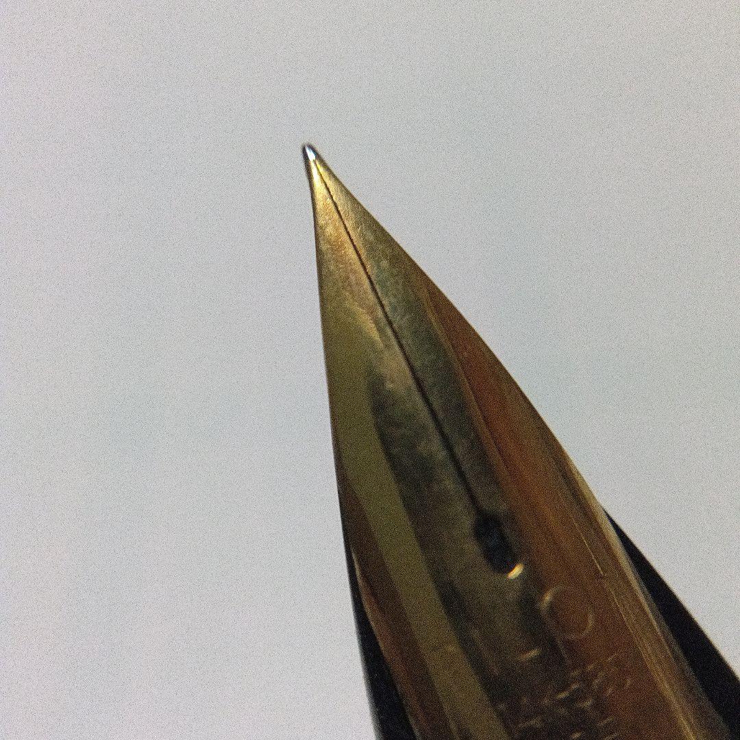 Black Pilot Desk Pen with 14K gold nib showing scratches and discoloration, accompanied by damaged storage box