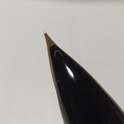Black Pilot Desk Pen with 14K gold nib showing scratches and discoloration, accompanied by damaged storage box