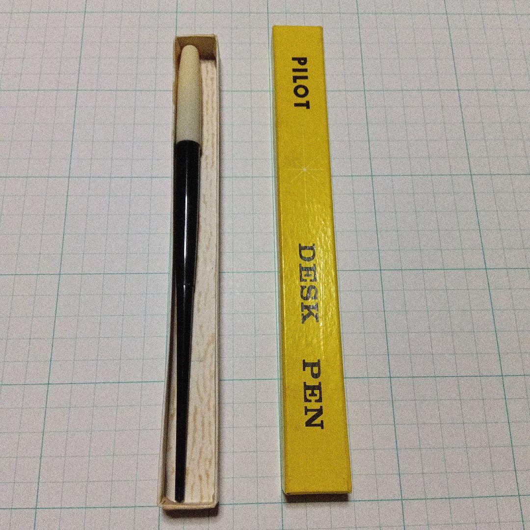 Black Pilot Desk Pen with 14K gold nib showing scratches and discoloration, accompanied by damaged storage box