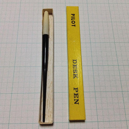 Black Pilot Desk Pen with 14K gold nib showing scratches and discoloration, accompanied by damaged storage box