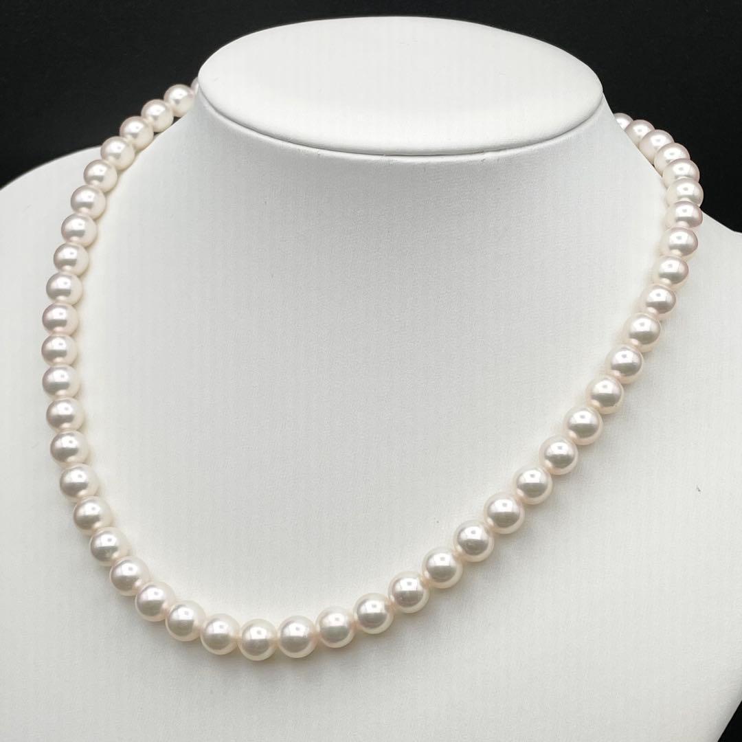 Tasaki Akoya pearl necklace with 7.0-7.5mm pearls and silver clasp on a white background
