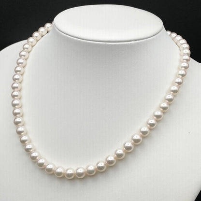 Tasaki Akoya pearl necklace with 7.0-7.5mm pearls and silver clasp on a white background