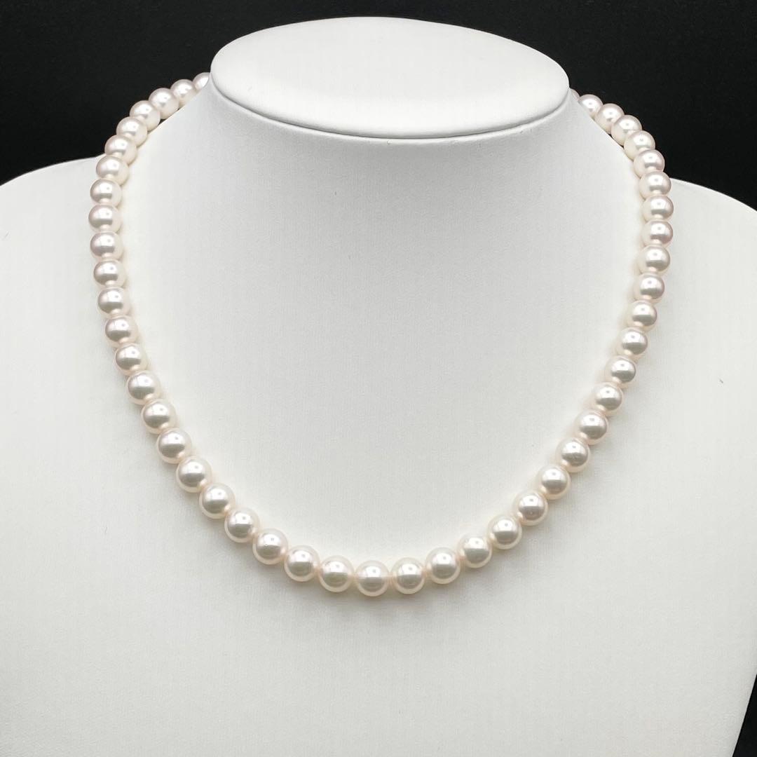 Tasaki Akoya pearl necklace with 7.0-7.5mm pearls and silver clasp on a white background