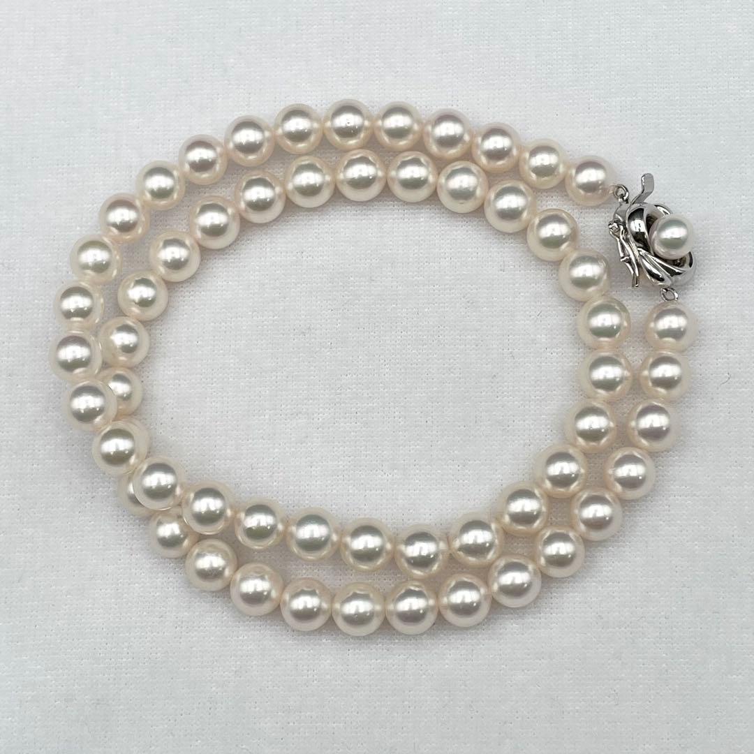 Tasaki Akoya pearl necklace with 7.0-7.5mm pearls and silver clasp on a white background
