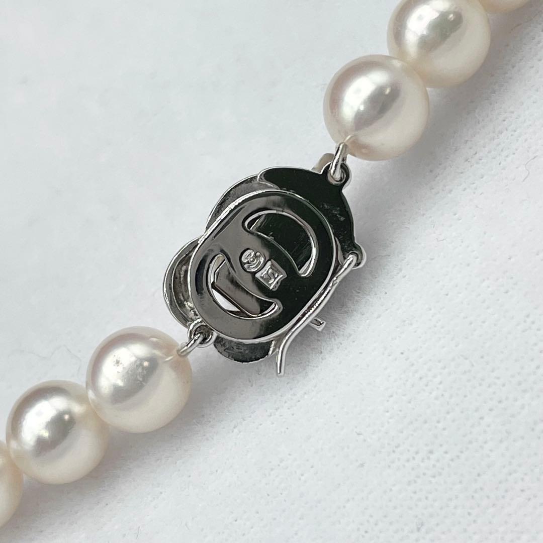 Tasaki Akoya pearl necklace with 7.0-7.5mm pearls and silver clasp on a white background