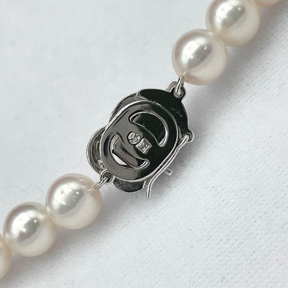 Tasaki Akoya pearl necklace with 7.0-7.5mm pearls and silver clasp on a white background