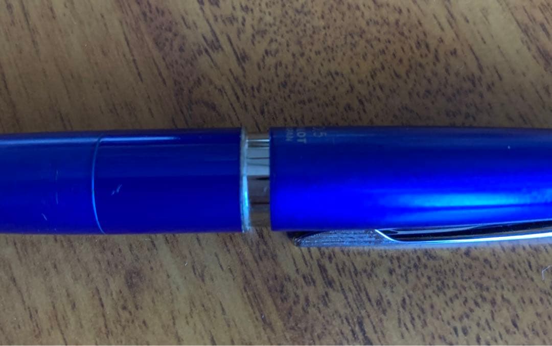 Pilot mechanical pencil in vibrant royal blue with click mechanism and minor paint chip on grip area