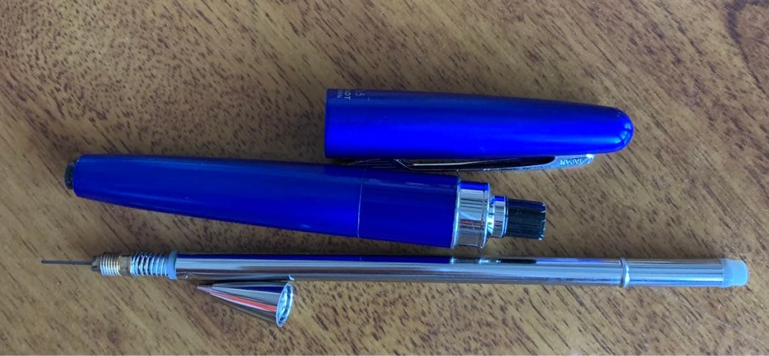Pilot mechanical pencil in vibrant royal blue with click mechanism and minor paint chip on grip area